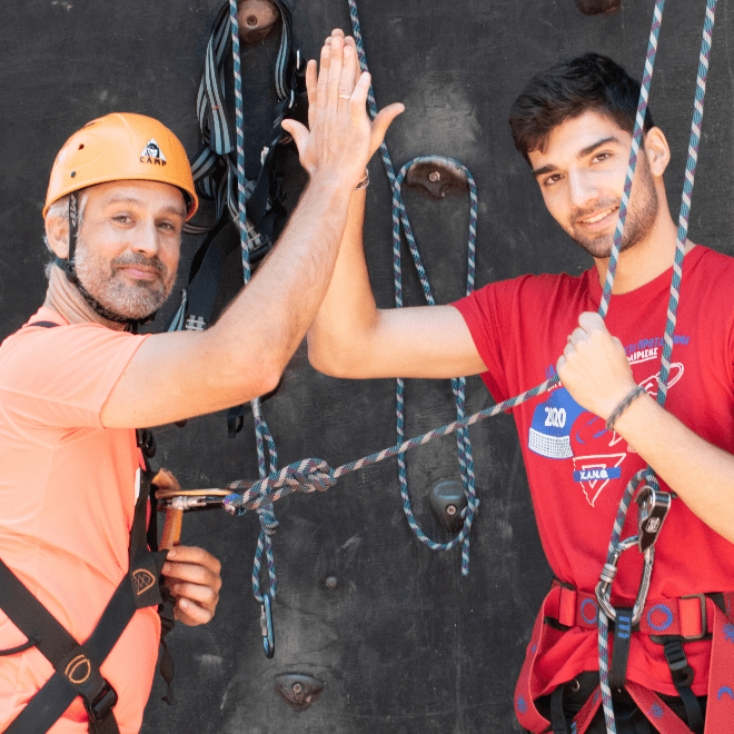 Baresquare employees wall climbing during offsite
