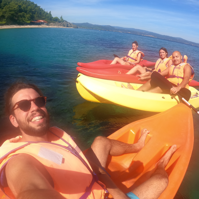Baresquare employees canoeing during offsite